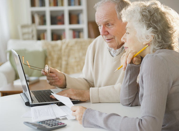 Older couple checking their insurance cover